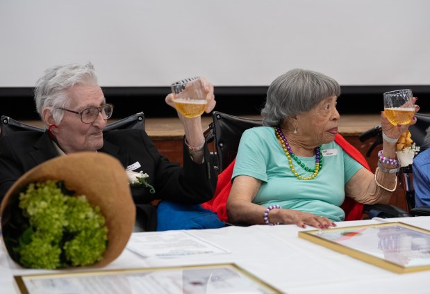 William Conrad, 100, left, and Helen Helen Hall, 100, raise a toast during a birthday celebration for people 100 years old and older at the New Jewish Home in Harlem on Tuesday, Sept. 30, 2025, in Manhattan, New York. (Barry Williams/ New York Daily News)