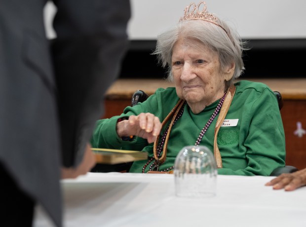 Rosa Caro, 100, is presented a New York State senate proclamation by New York City Council member Shaun Abreu during a birthday celebration for people 100 years old and older at the New Jewish Home in Harlem on Tuesday, Sept. 30, 2025, in Manhattan, New York. (Barry Williams/ New York Daily News)