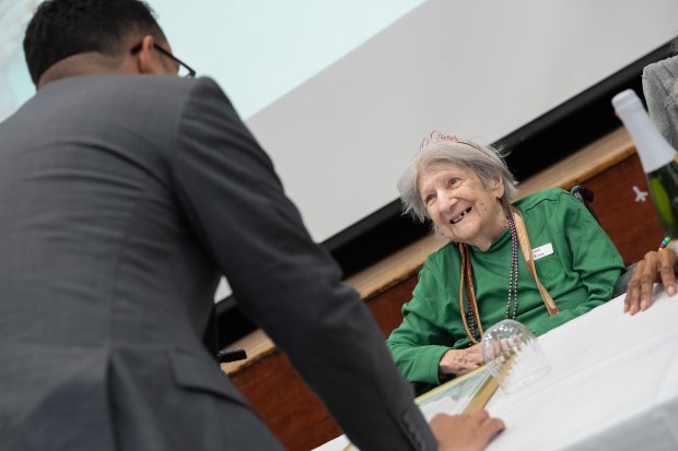 Rosa Caro, 100, is presented a New York State senate proclamation by New York City Council member Shaun Abreu during a birthday celebration for people 100 years old and older at the New Jewish Home in Harlem on Tuesday, Sept. 30, 2025, in Manhattan, New York. (Barry Williams/ New York Daily News)